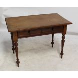 A mahogany two drawer writing table, width 106cm.