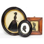 A Victorian paper cut work silhouette of lady in oval glazed frame, 25.