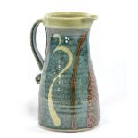 DAVID FRITH (born 1943) for Brookhouse Pottery; a stoneware jug, khaki decoration on blue ground,