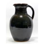 RAY FINCH (1914-2012) for Winchcombe Pottery; a large stoneware jug covered in tenmoku glaze,