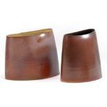 JANE HAMLYN (born 1940); two elliptical stoneware forms covered in metallic glaze,