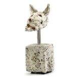 IAN GREGORY (born 1942); a heavily grogged stoneware sculpture of a dog's head mounted on a cube,