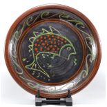 CLIVE BOWEN (born 1943); a large slipware charger decorated with a fish, diameter 54.5cm (D).