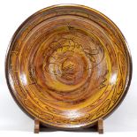 CLIVE BOWEN (born 1943); a large slipware charger decorated with a shrimp, diameter 57cm,