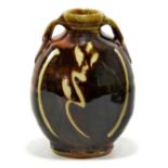 MIKE DODD (born 1943); a twin handled stoneware bottle, wax resist decoration on tenmoku ground,