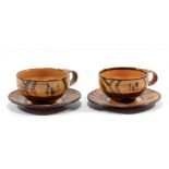 MICHAEL CARDEW (1901-1983) for Winchcombe Pottery; a near pair of slipware cups and saucers,