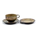 MICHAEL CARDEW (1901-1983) for Winchcombe Pottery; a slipware cup and saucer (and an extra saucer),