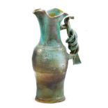 COLIN PEARSON (1923-2007); a stoneware jug with twisted handle covered in semi matt turquoise glaze,