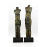 LYN LOVITT (born 1941); two stoneware figures, matt blue and yellow glaze, mounted on wooden bases,