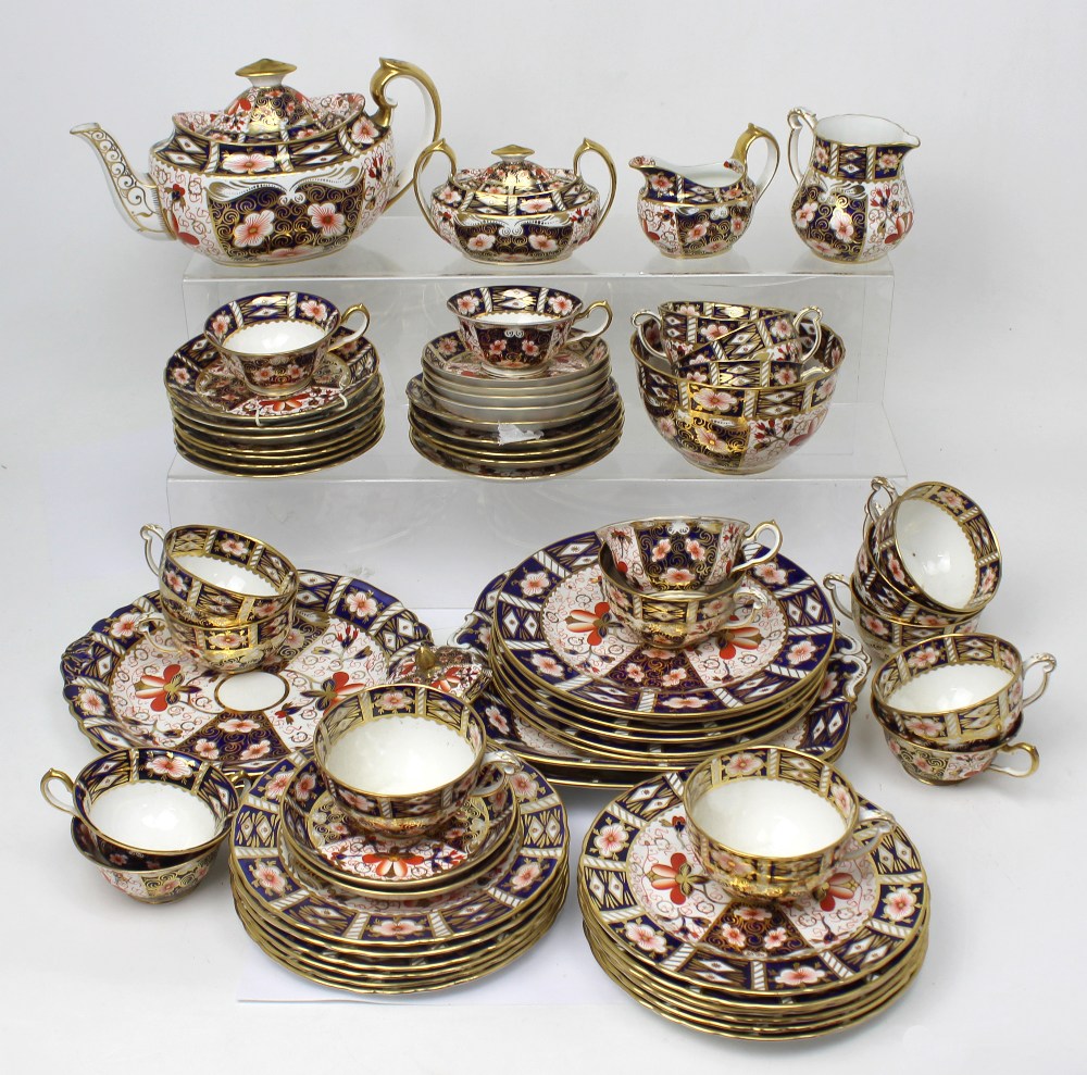 A large quantity of Royal Crown Derby Old Imari palette dinner and teaware to include three cake