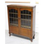 A c1930s mahogany two-door glazed bookcase with three interior shelves, length 93cm.