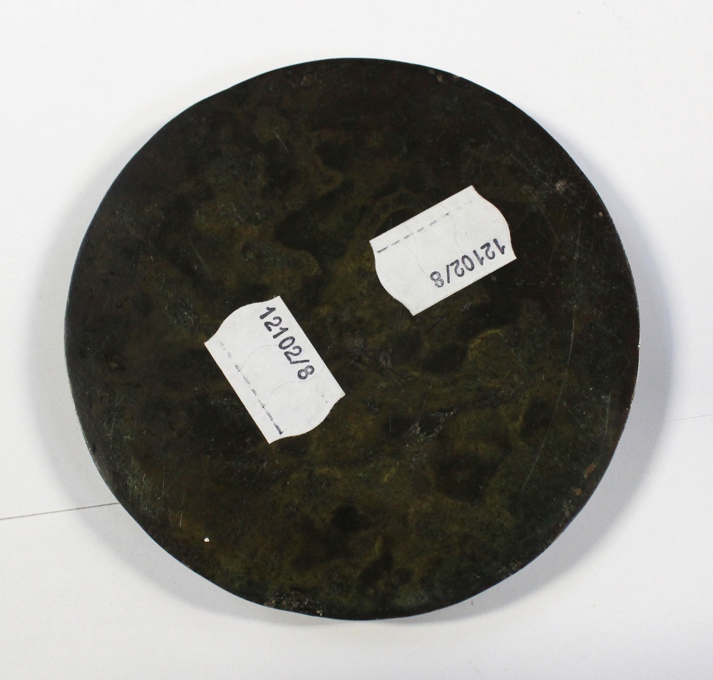 An Oriental round bronze plaque with figural decoration, diameter 10.5cm. - Image 5 of 5