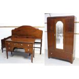 An early 20th century mahogany single mirror door wardrobe with arched top,