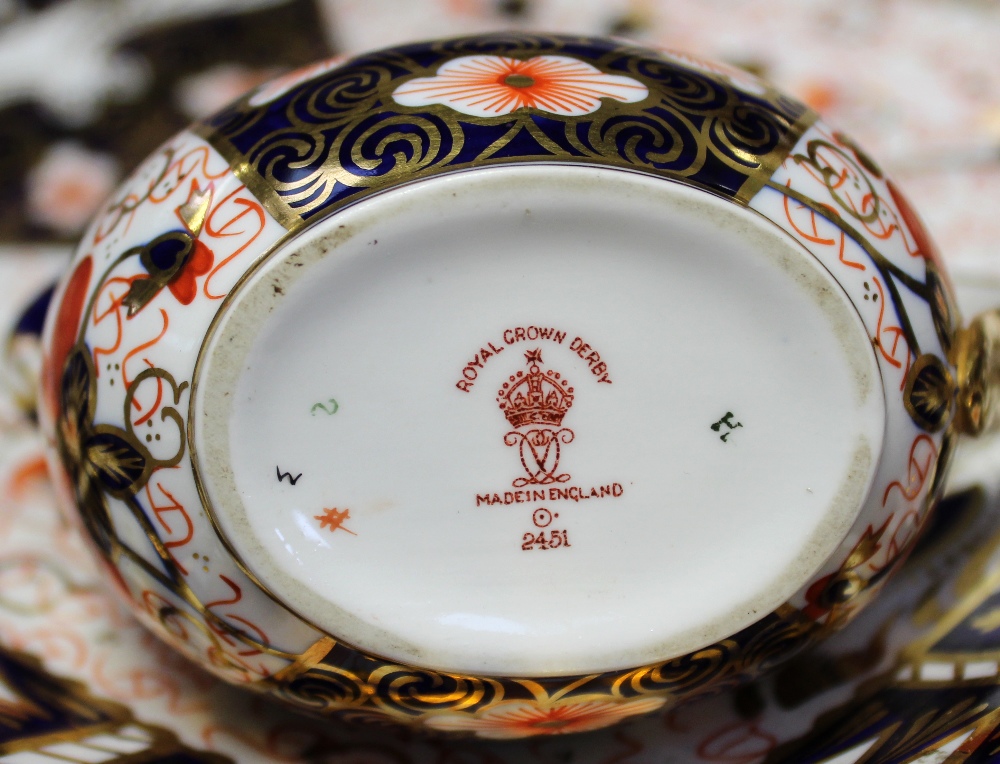 A large quantity of Royal Crown Derby Old Imari palette dinner and teaware to include three cake - Image 3 of 6