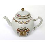 An 18th century Chinese Famille Rose armorial ovoid teapot, gilded shield with lion,