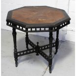 A late 19th century octagonal ebonised and burr walnut occasional table with gallery rim on turned