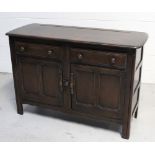An Ercol 'Old Colonial' style sideboard of small proportions,