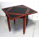 A contemporary card table with four triangular fold-out sections to top,