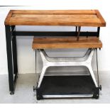 A Workmate bench, wooden top, adjustable height, with pull-out sections on a black metal base,