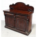 A Victorian mahogany sideboard, curved scrolling back to two bow-front frieze drawers,