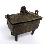 A 19th century Oriental bronze censer with Dog of Fo finial to pierced top,