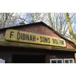 A wooden sign inscribed 'F Dibnah & Sons Bolton', width approx. 79".