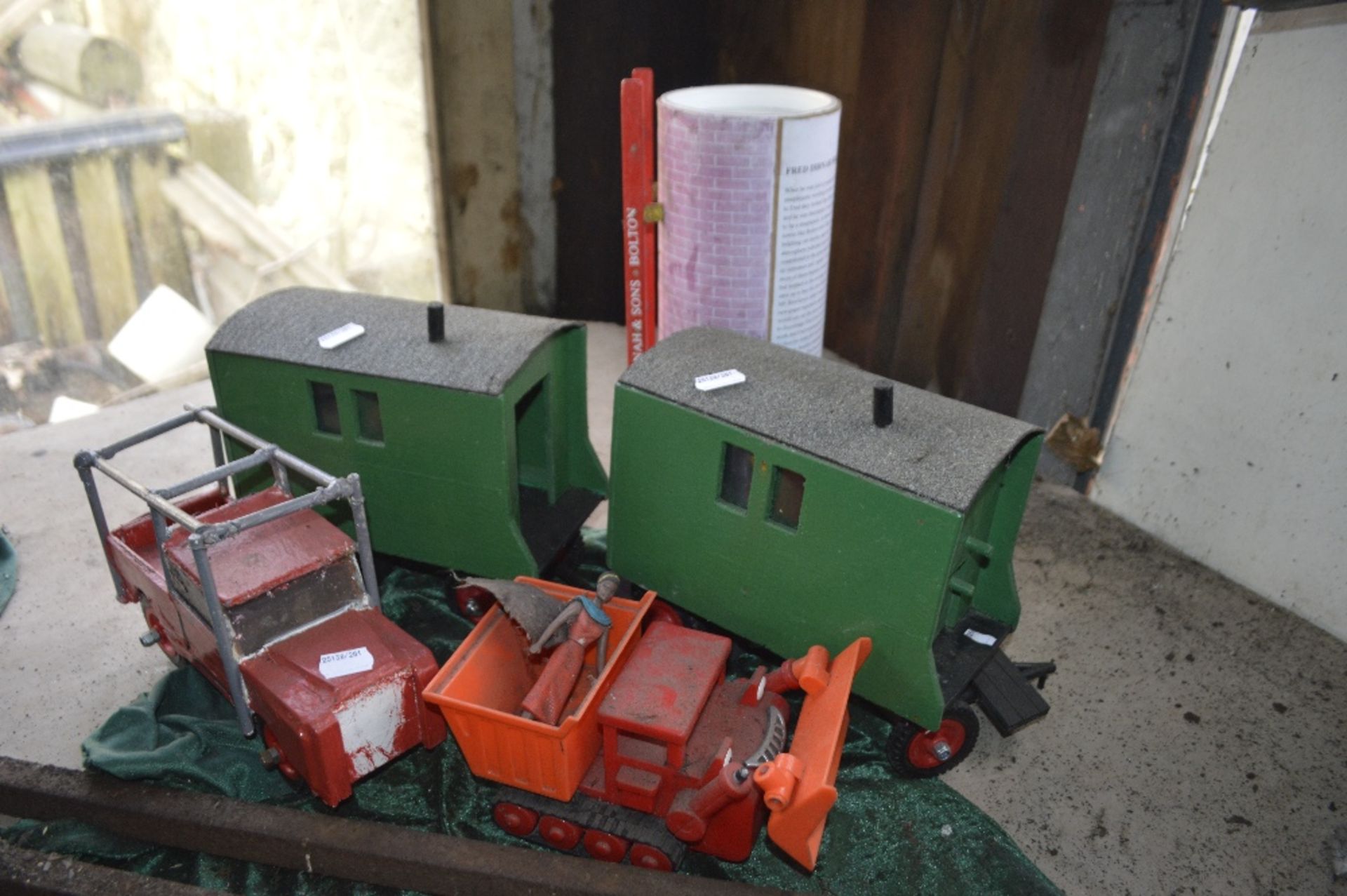 A miniature truck inscribed 'F Dibnah & Sons Bolton', two trailers,