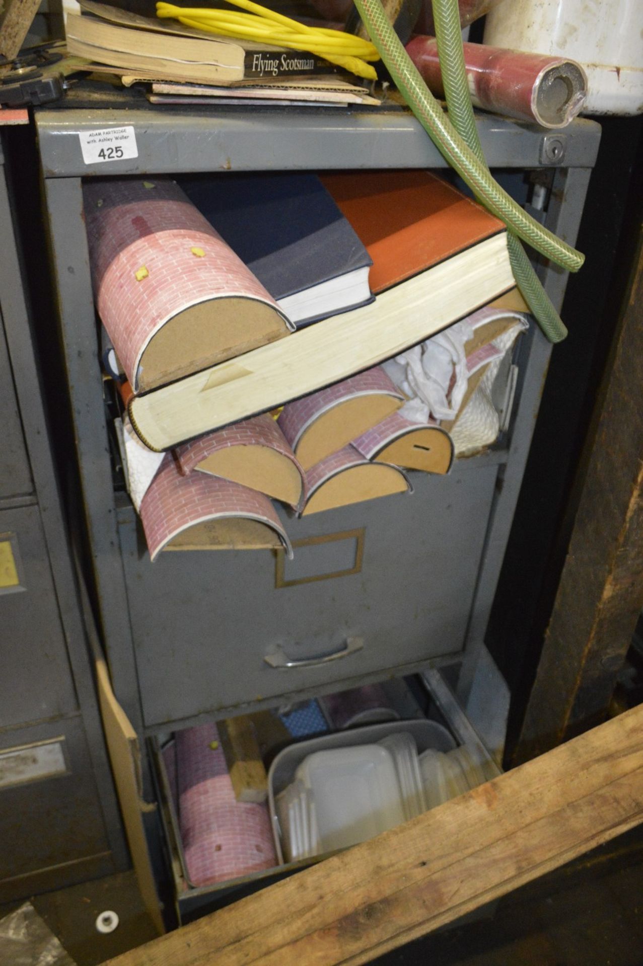 A three drawer filing cabinet (one missing).