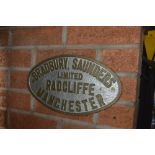 An oval plaque, inscribed 'Bradbury, Saunders Ltd. Radcliffe Manchester', width approx. 13".