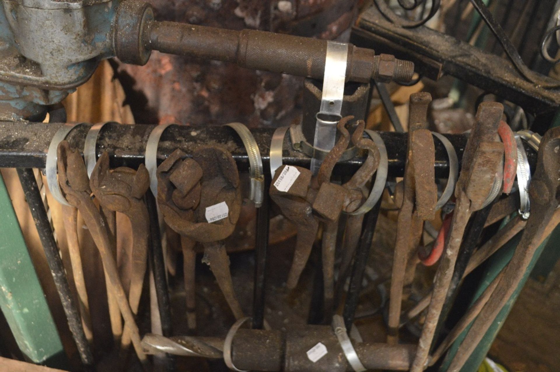 Ten pairs of variously sized blacksmith's tongs, length of longest approx. 28 1/2" (10).