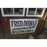 A sign inscribed 'Fred Dibnah Steeplejack Bolton Lancs', approx. 3ft x 2ft.