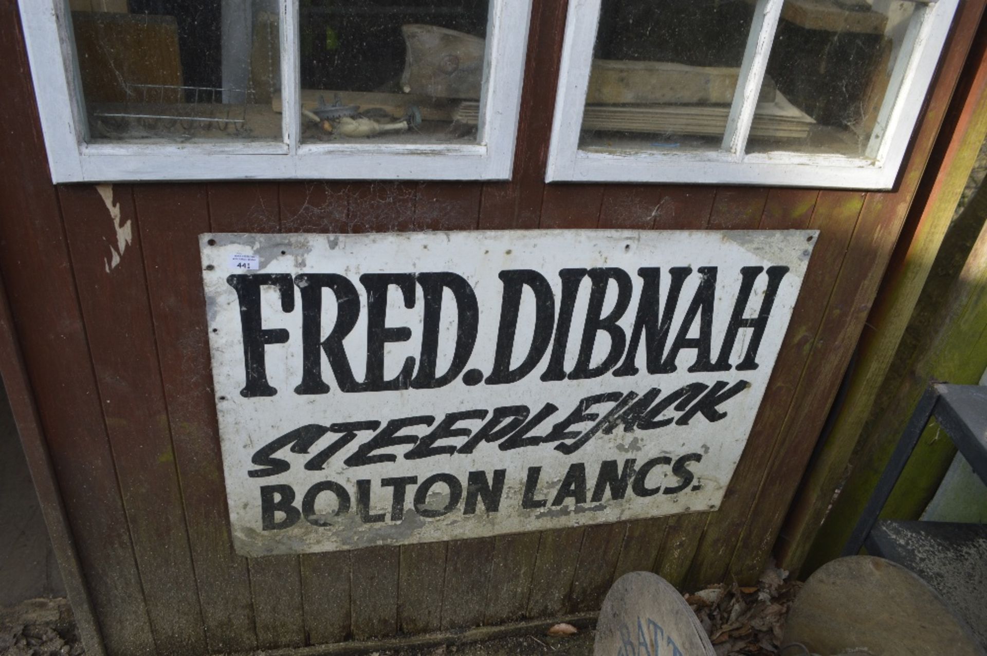 A sign inscribed 'Fred Dibnah Steeplejack Bolton Lancs', approx. 3ft x 2ft.