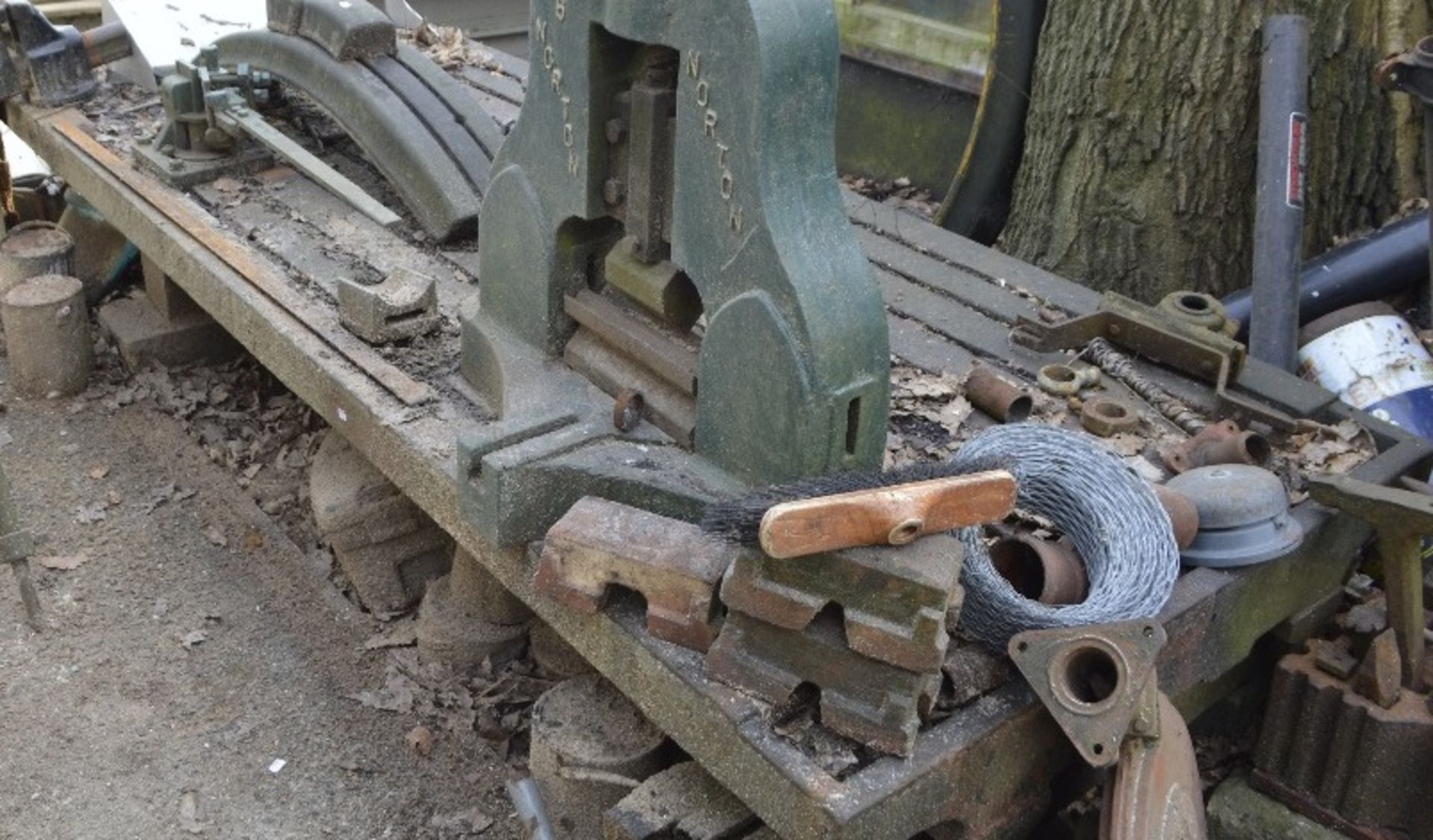 A cast iron bench, approx. 4ft x 10ft.