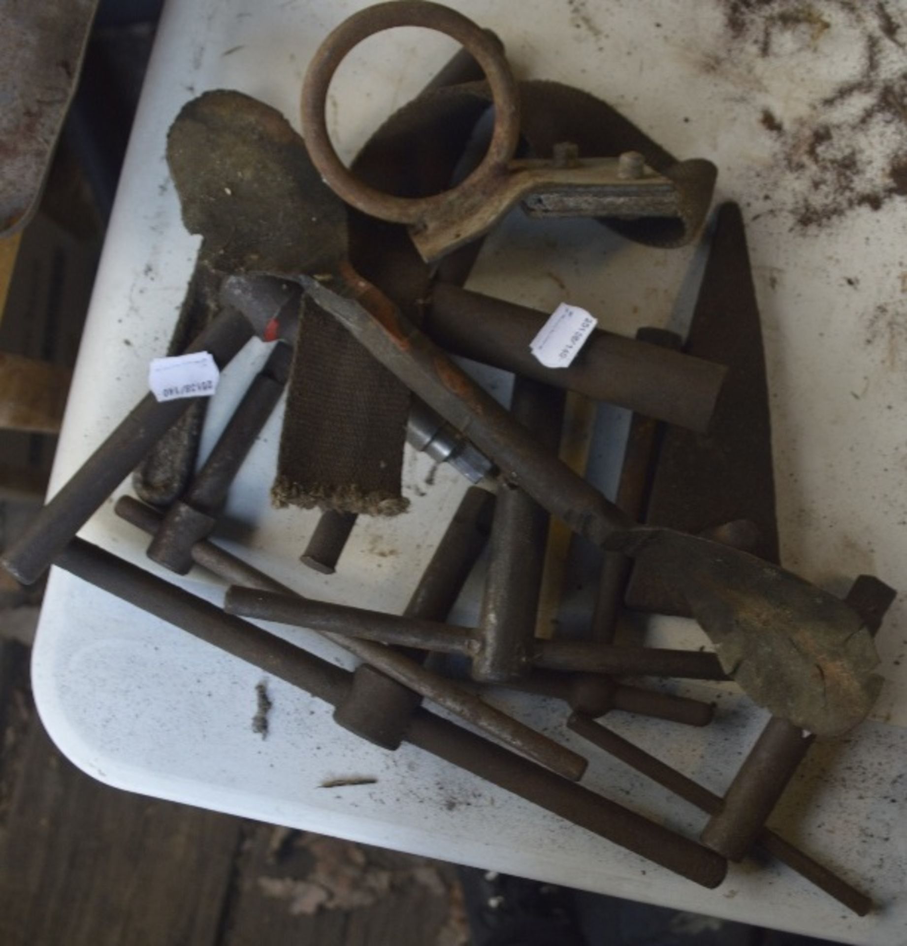 A group of miscellaneous items to include T bars, ring spanner etc.