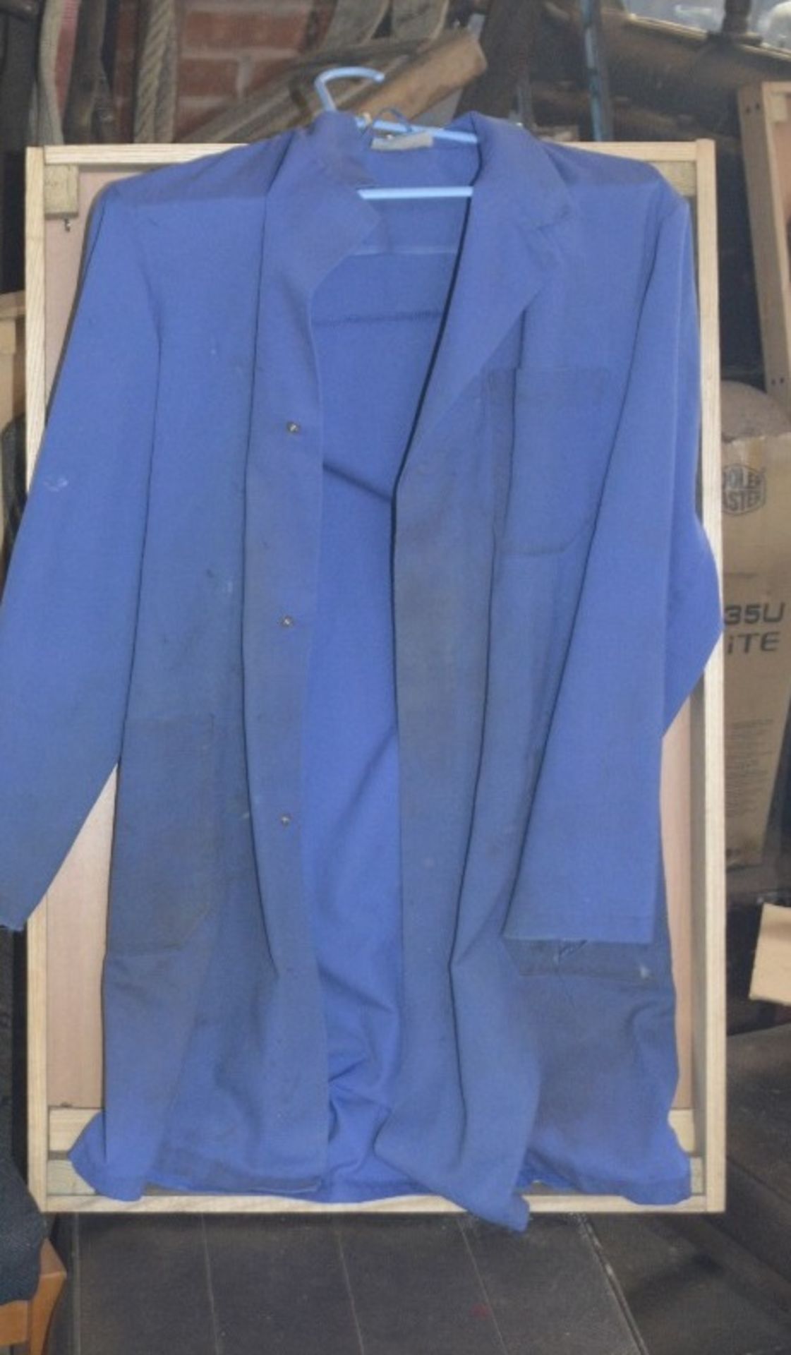 WITHDRAWN A blue overall believed to have been owned and worn by Fred Dibnah, in display case.