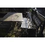 A garden table and three chairs, and a cast iron ended garden bench (5).