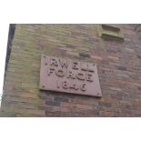 A large heavy cast iron plaque inscribed 'Irwell Forge 1846'.