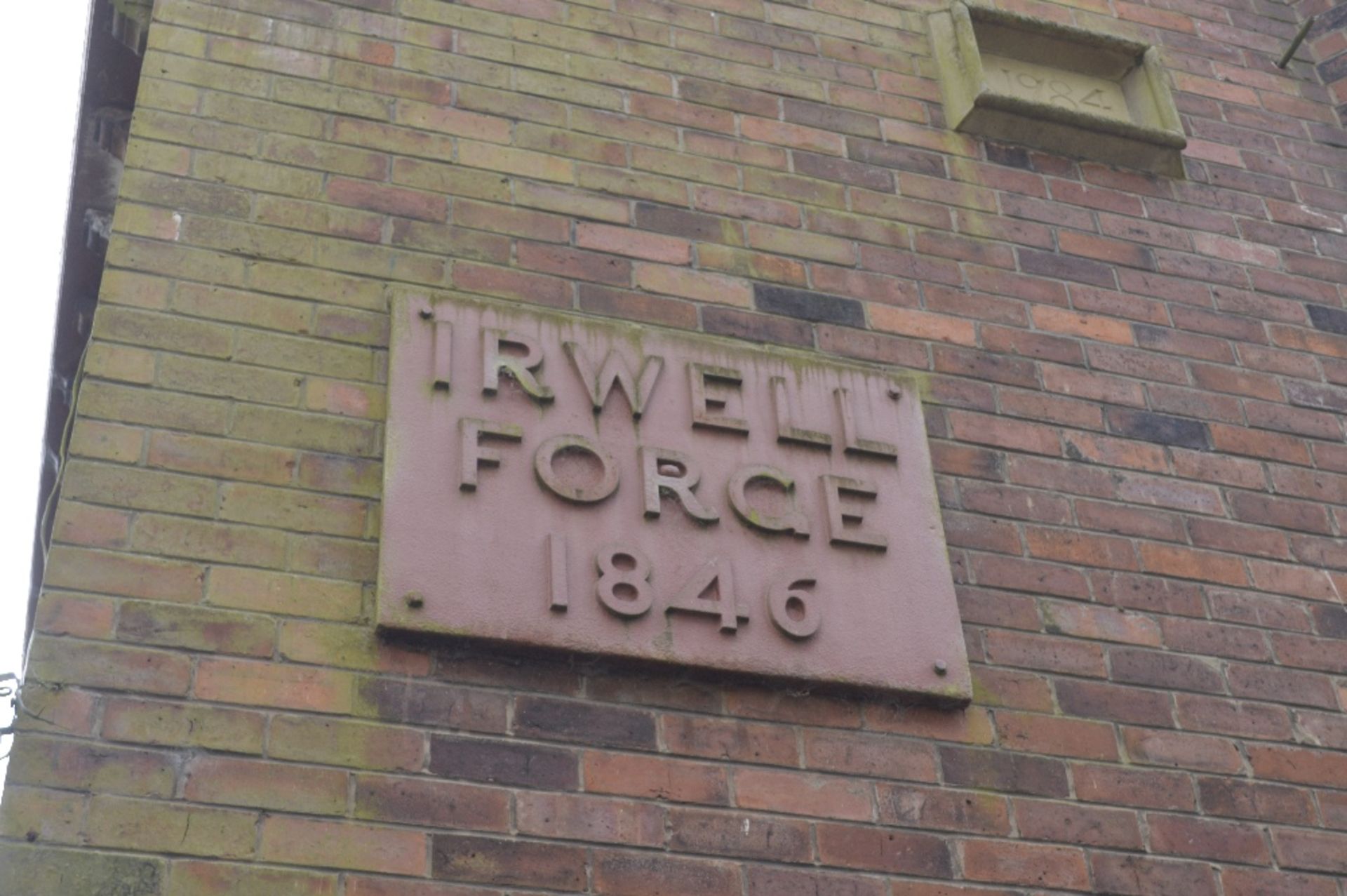 A large heavy cast iron plaque inscribed 'Irwell Forge 1846'.