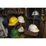 A Stihl safety helmet and further helmets (strictly for decorative purposes only).