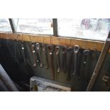 Seventeen various spanners, length of longest approx. 24" and a small chain.