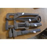 Three adjustable spanners, length of longest approx. 15" and a pair of plyers (4).