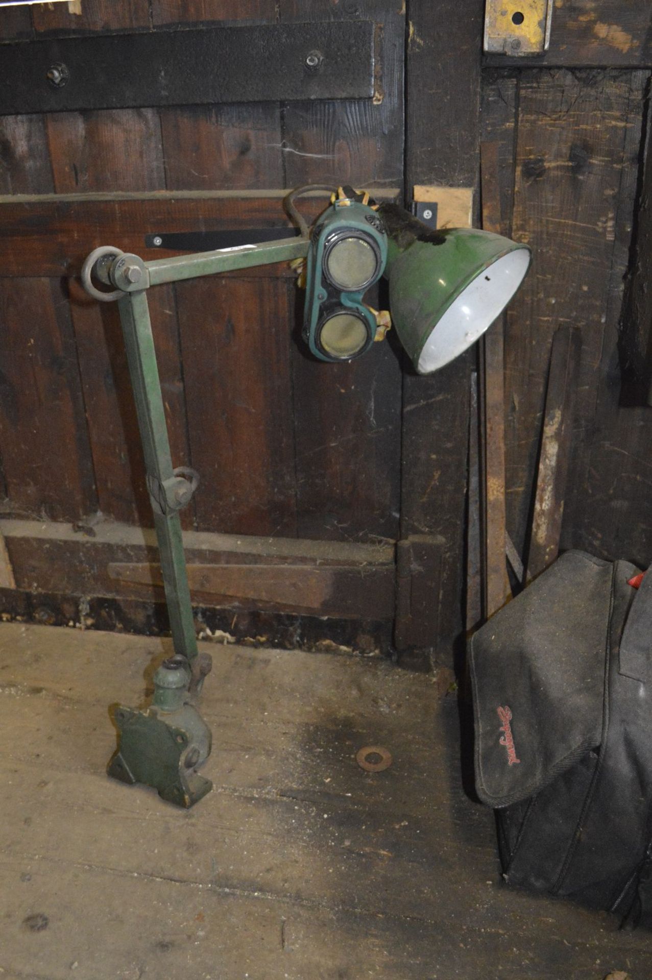 An angle poise lamp, inscribed 'Made in England', and a pair of welding goggles (2).