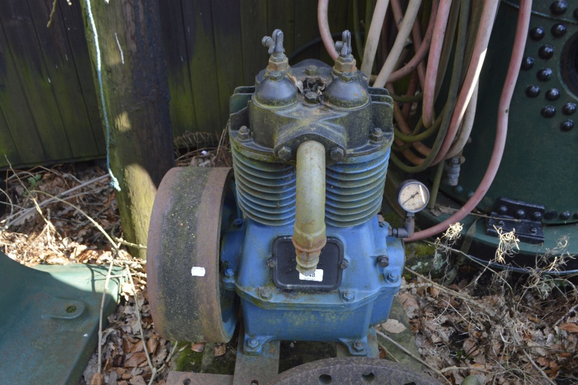 A compressor, height approx. 26".