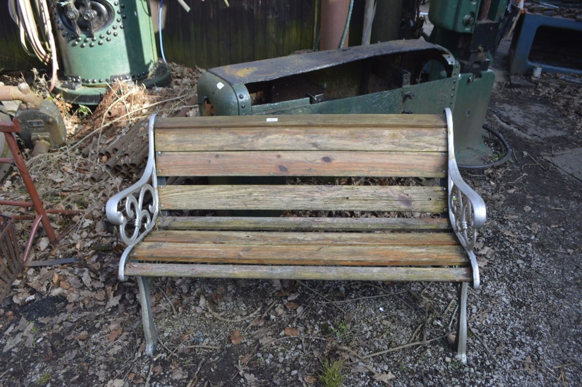 A cast iron ended garden bench, width approx. 49".