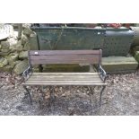 A cast iron ended garden bench, width approx. 47".