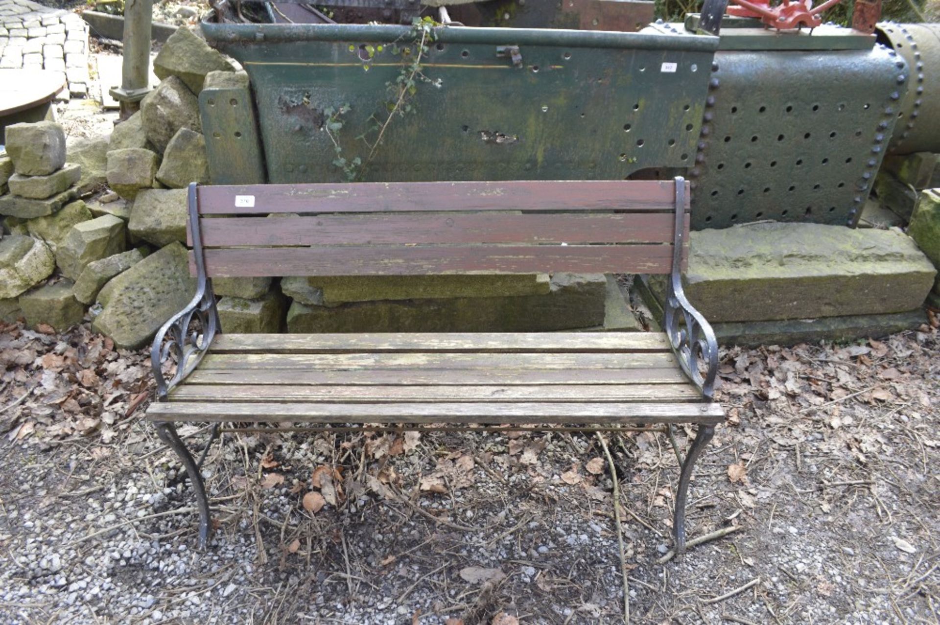 A cast iron ended garden bench, width approx. 47".