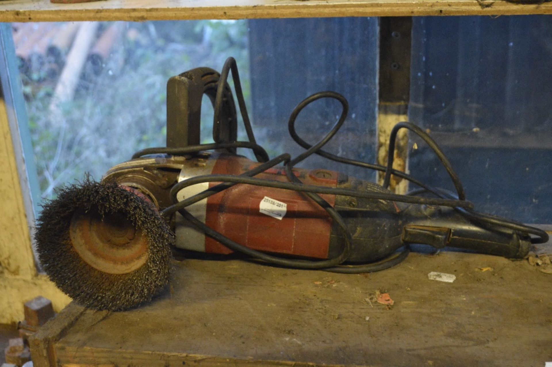 A Clarke angle grinder with wire brush head.