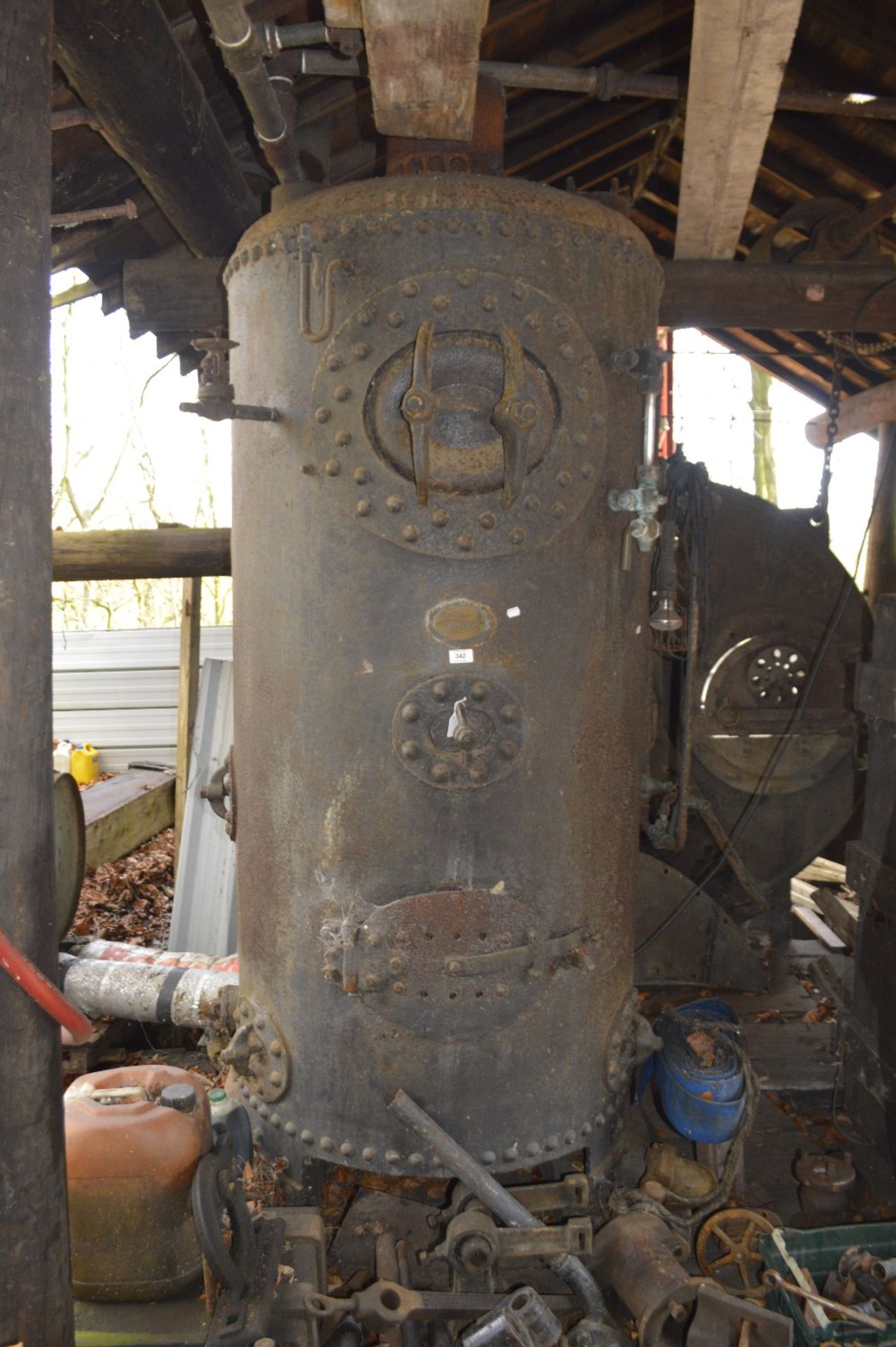 A cast iron steam boiler by Chris Holden Ltd. Blackburn, height approx. 7ft.