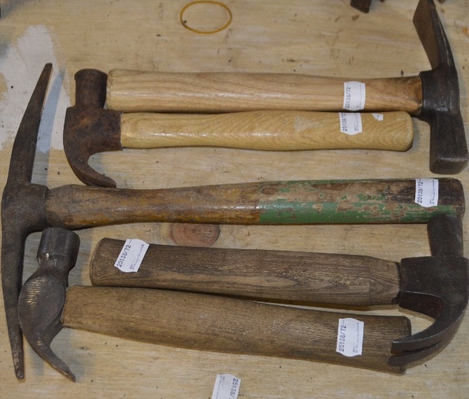 Four wooden handled hammers, each approx. 10", and a pick axe (5).