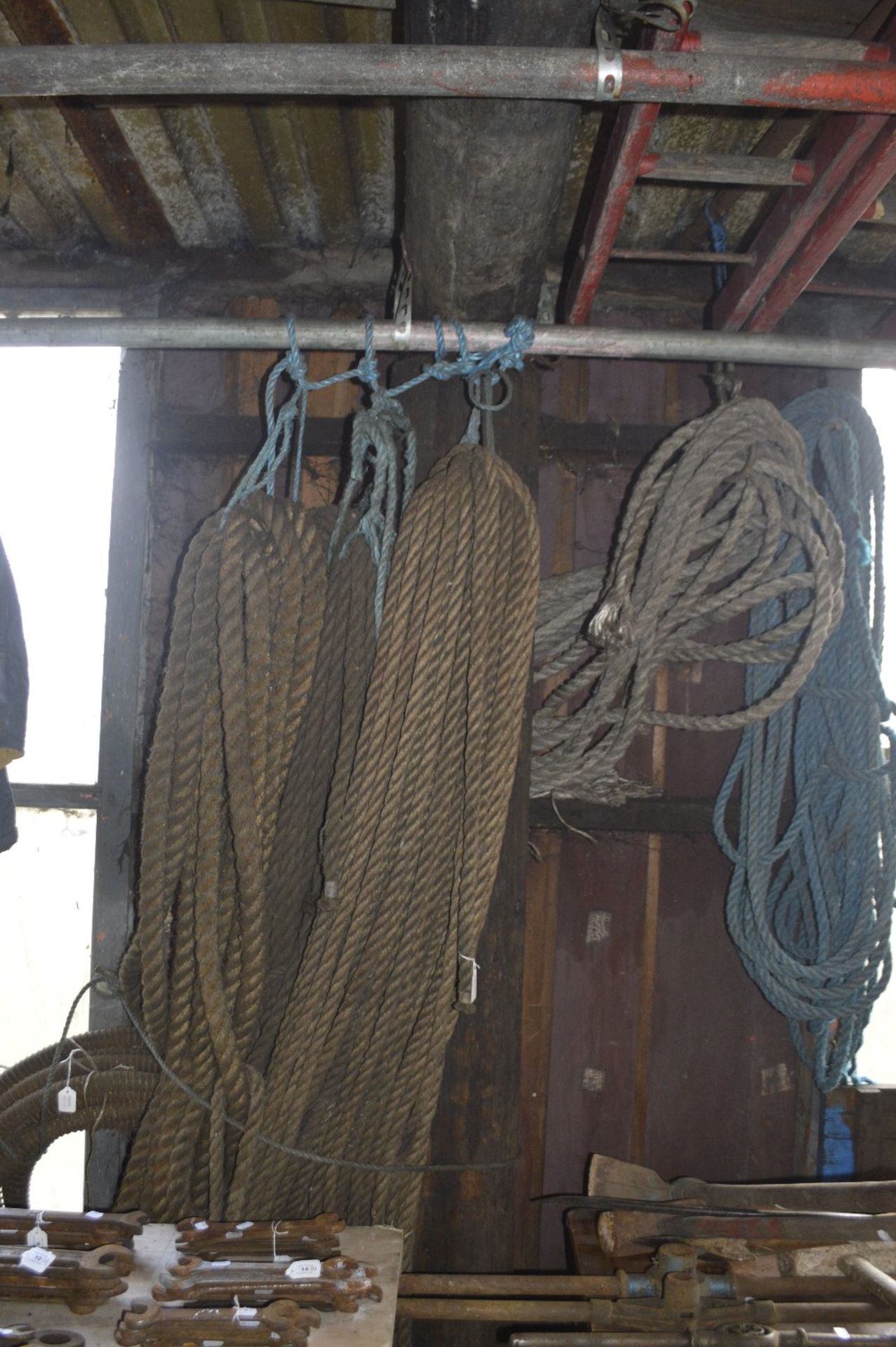 Several lengths of rope and a length of pipe.